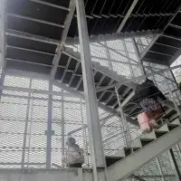 Expanded metal protection for external stairs
